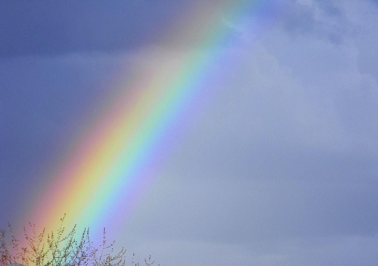 Rainbow in cloudy sky